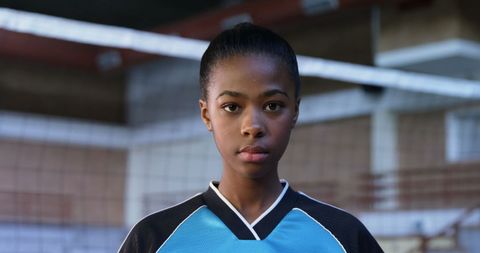 Confident Female Volleyball Player in Sports Arena