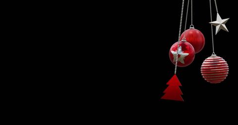 Festive Red and Silver Christmas Ornaments on Black Background