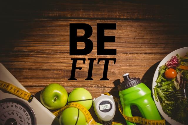 Digital composite of be fit message against table