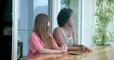 Multicultural friends enjoy scenic hotel balcony view