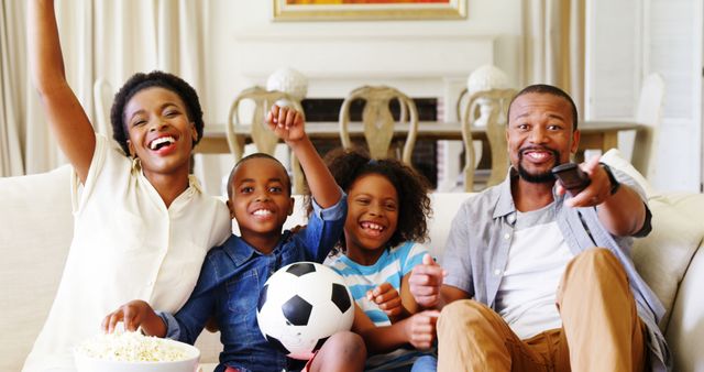 Happy Family Enjoying Soccer Game on TV - Download Free Stock Images Pikwizard.com