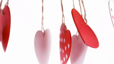 Red and White Heart Ornaments Hanging on Strings