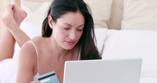 Woman Shopping Online with Credit Card in Bed - Download Free Stock Images Pikwizard.com