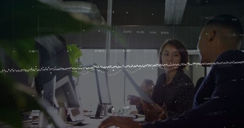 Business Colleagues Analyzing Data Insights in Modern Office Environment