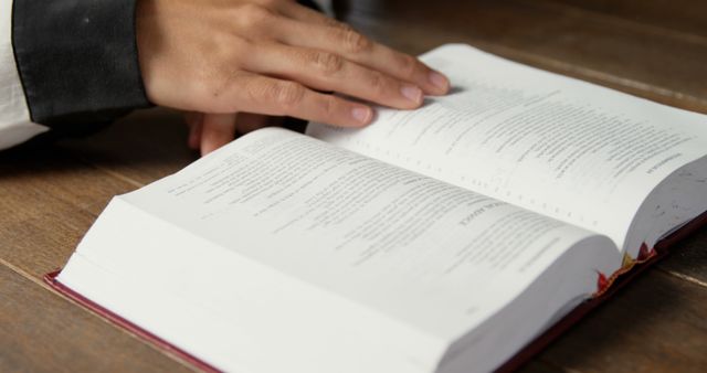 Person Reading Open Bible on Wooden Table - Download Free Stock Images Pikwizard.com