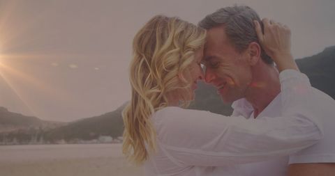 Romantic Embrace Lakeside at Sunset with Light Trails