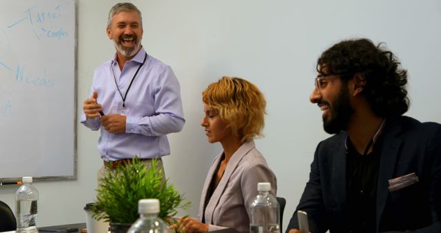 Diverse Team Brainstorming and Smiling During Business Meeting - Download Free Stock Images Pikwizard.com