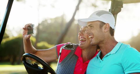 Excited Golfers Capturing Fun Moments in Golf Cart