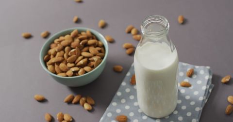 Almond Milk Bottle and Almonds on Polka Dot Cloth - Download Free Stock Images Pikwizard.com