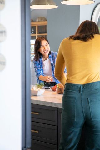 Diverse Female Friends Enjoying Time Together in Modern Kitchen