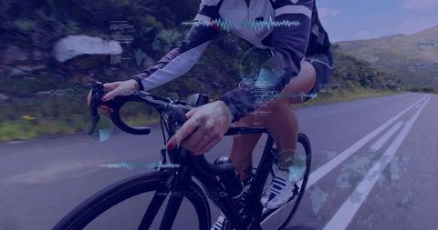 Riding high-performance road bike on mountain road with telemetry hud overlay