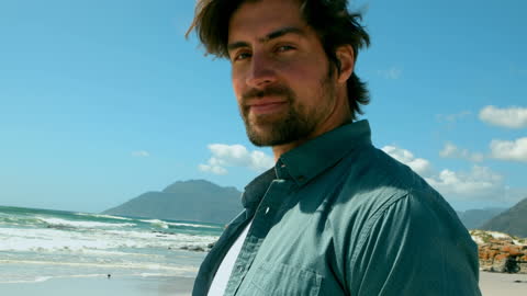Relaxed Man Enjoying Sunny Day at Scenic Beach