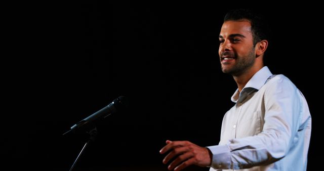 Confident Man Delivering Speech at Podium with Copy Space - Download Free Stock Images Pikwizard.com