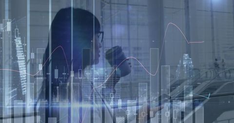 Businesswoman Analyzing Financial Data Surrounded by Graphs