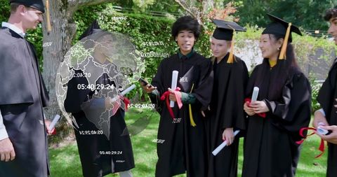 Graduates celebrating with smartphone projecting holographic globe at outdoor graduation