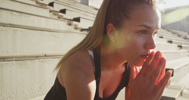 Young Woman Focusing On Pre-Workout Routine Outdoors - Download Free Stock Images Pikwizard.com