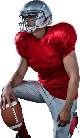 Athlete kneeling in red football gear on transparent background