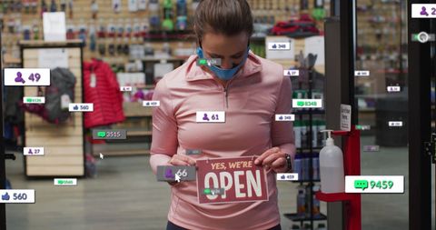 Female Shop Worker Wearing Mask Opening Store with Social Media Engagement
