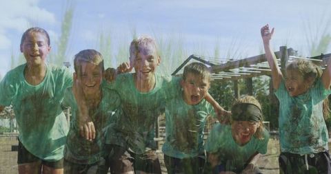 Joyful Kids Enjoying Mud Fun in Outdoor Adventure