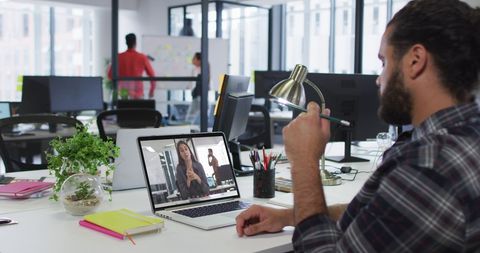 Professional Video Call in Modern Office Setting - Download Free Stock Images Pikwizard.com