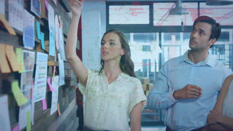 Team Analyzing Data in Modern Office with Digital Interface Overlay