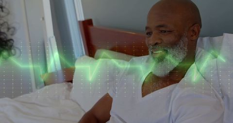 Smiling Patient with Digital Cardiograph Overlay in Hospital Room