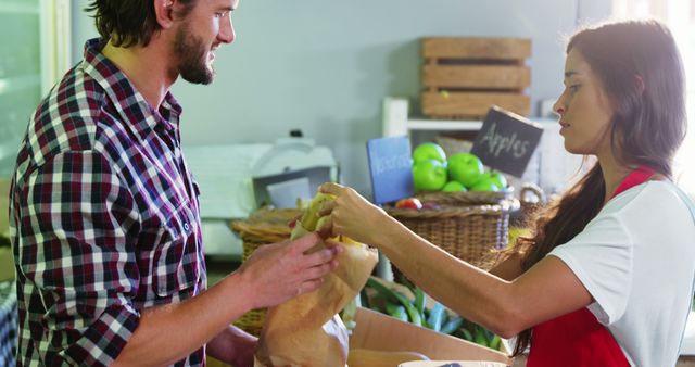 Customer collecting grocery order from farmer's market vendor - Download Free Stock Images Pikwizard.com