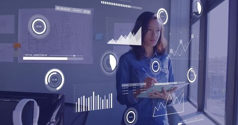 Businesswoman Analyzing Digital Data Visuals in Modern Office