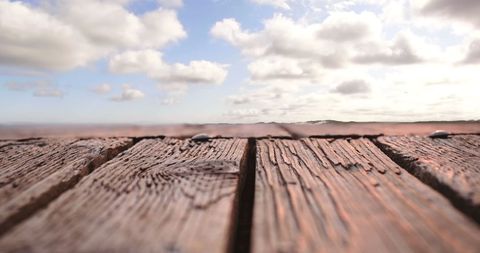 Rustic Wooden Plank Overlook with Cloudy Sky and Flying Bird - Download Free Stock Images Pikwizard.com
