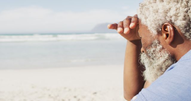 Elderly Man Gazing at Ocean from Sandy Beach - Download Free Stock Images Pikwizard.com