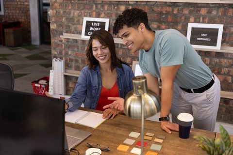 Diverse Coworkers Collaborate Creatively in Modern Workspace