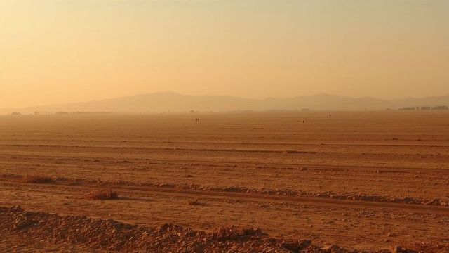 Majestic arid plain with silhouettes at sunrise adventure