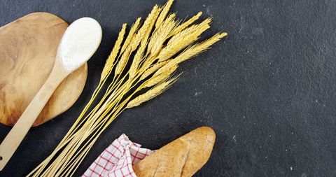 Artisanal Bread Baking Concept with Wheat Stalks and Fresh Loaf
