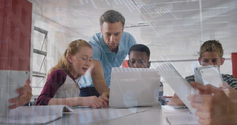 Teacher Guiding Students on Digital Devices in Tech-Enhanced Classroom