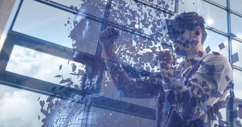 Man interacting with digital fragmented human figure