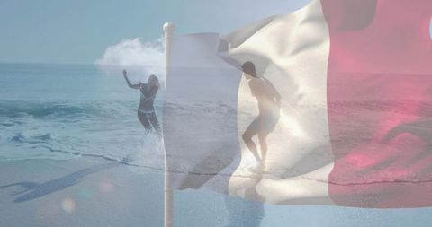 Waving translucent french tricolor flag overlaying sunlit shore with couple splashing