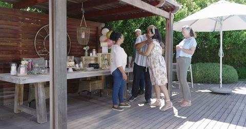 Diverse friends celebrating a joyous outdoor gathering