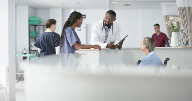 Medical Team Collaborating in Hospital Setting - Download Free Stock Images Pikwizard.com