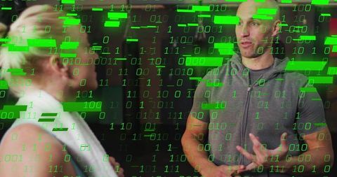 Athletic trainer and client in digital workout discussion overlaid with binary code
