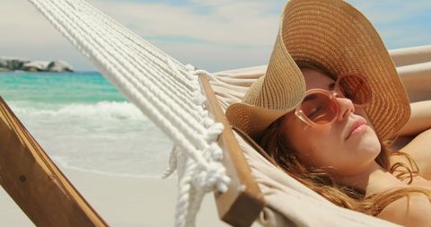 Caucasian Woman Relaxing on Beach Hammock with Straw Hat and Sunglasses - Download Free Stock Images Pikwizard.com