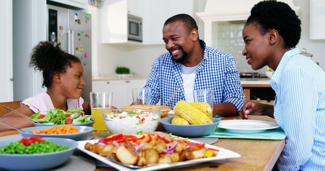 Happy African American Family Enjoying Meal Together in Kitchen - Download Free Stock Images Pikwizard.com