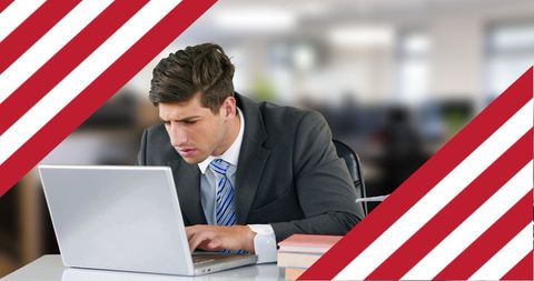 Focused Businessman Using Laptop with USA Flag Overlay