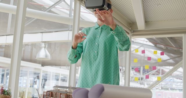 Designer Using Virtual Reality Headset in Modern Office - Download Free Stock Images Pikwizard.com