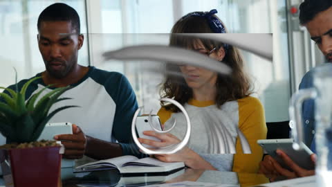 Diverse Colleagues Using Tablets in Modern Office with Digital Overlay