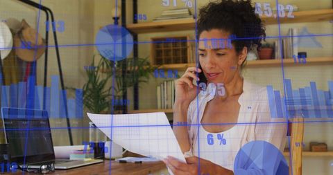 Businesswoman Analyzing Dynamic Financial Data in Modern Office