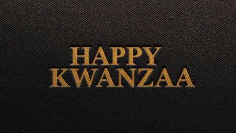 Gold embossed happy kwanzaa text on black leather texture luxury holiday typography