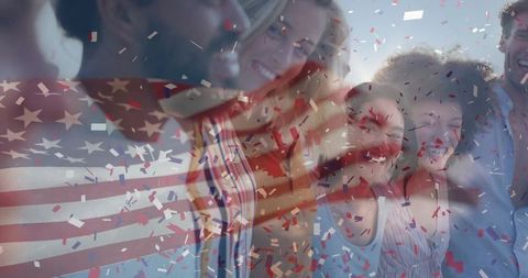 Joyful Group Celebrating with American Flag and Confetti