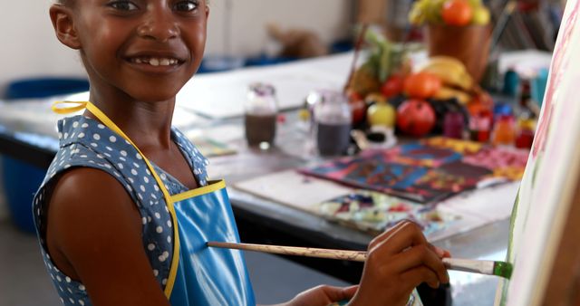 Smiling Girl Painting at Art Class in Studio with Fruits Background - Download Free Stock Images Pikwizard.com