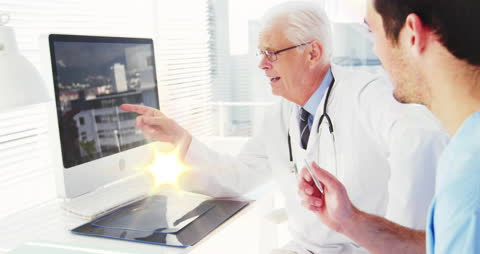 Doctors Analyzing Medical Data on Computer with Futuristic Interface