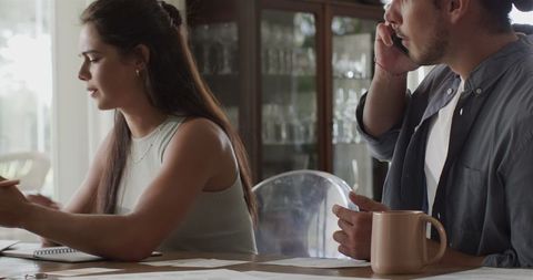 Couple discussing wedding details at home